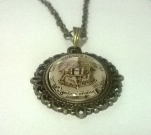 Медальйон Harry Potter Hogwarts 4х3 см. -   -  